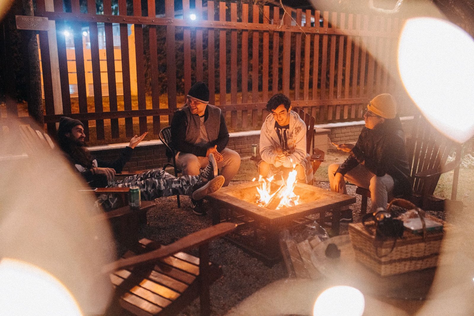 A group around an outdoor fire in the evening