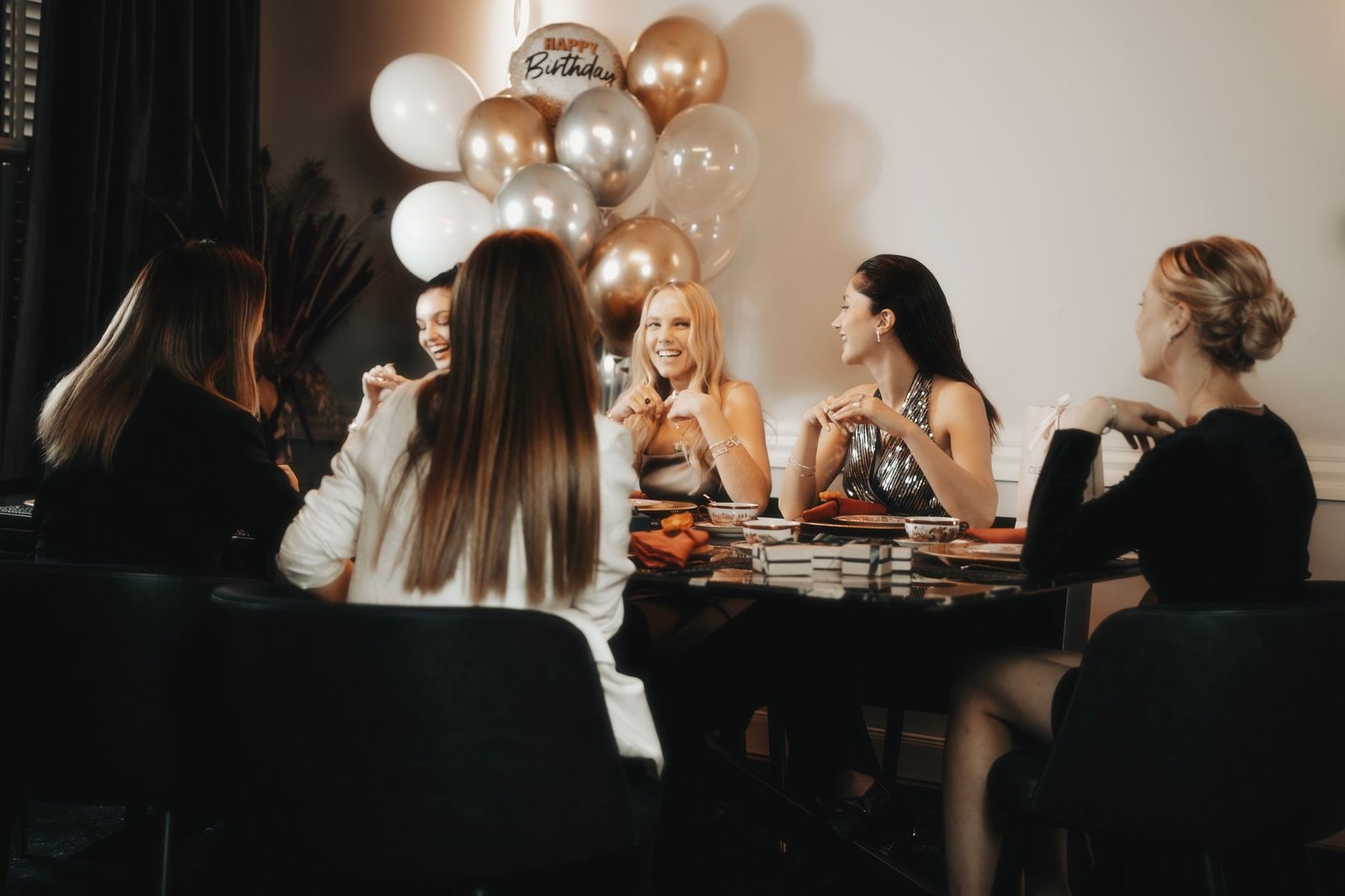 Friends celebrating around a dinner table