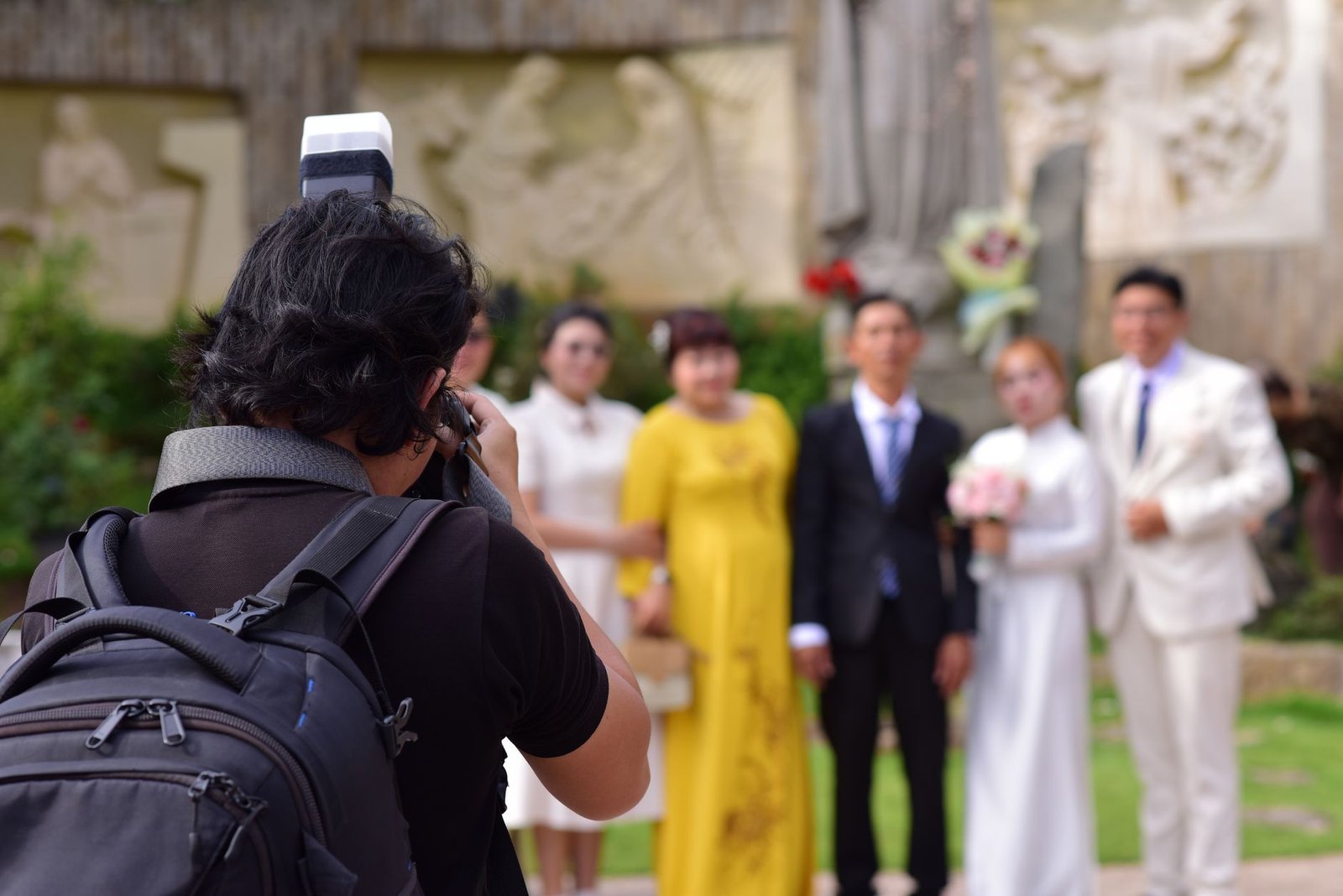 A photographer at work during an outdoor ceremony